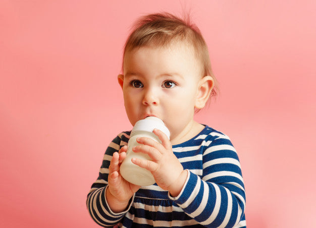 https://perrymackin.com/cdn/shop/articles/portrait-cute-toddler-drinking-milk-from-bottle_74333-439_2048x.jpg?v=1559749764