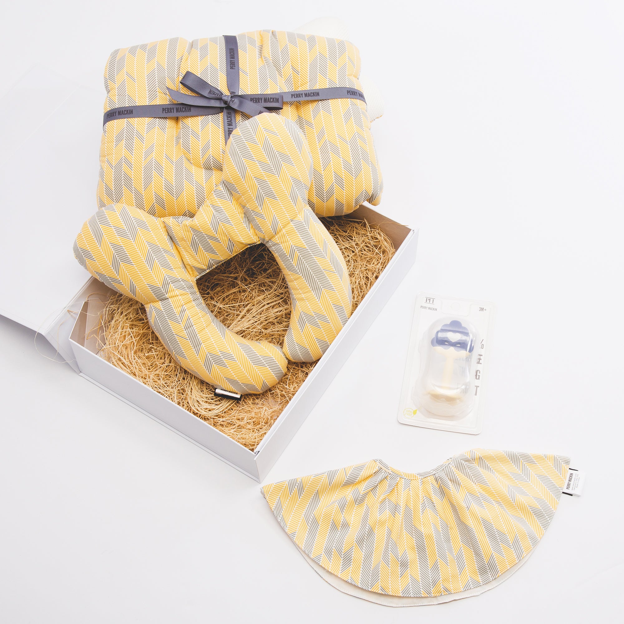 yellow baby bib, teether, neck pillow set